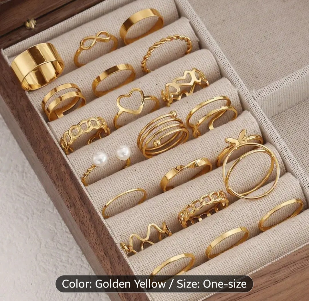 A Set of 22 Womens Rings in Golden Color Featuring Vintage, Fashionable, Minimalist, And Elegant Designs with Hollow Heart And Spiral Shapes. This Golden Ring Set Is Suitable for Daily Wear, Vacations, Parties, And Weddings