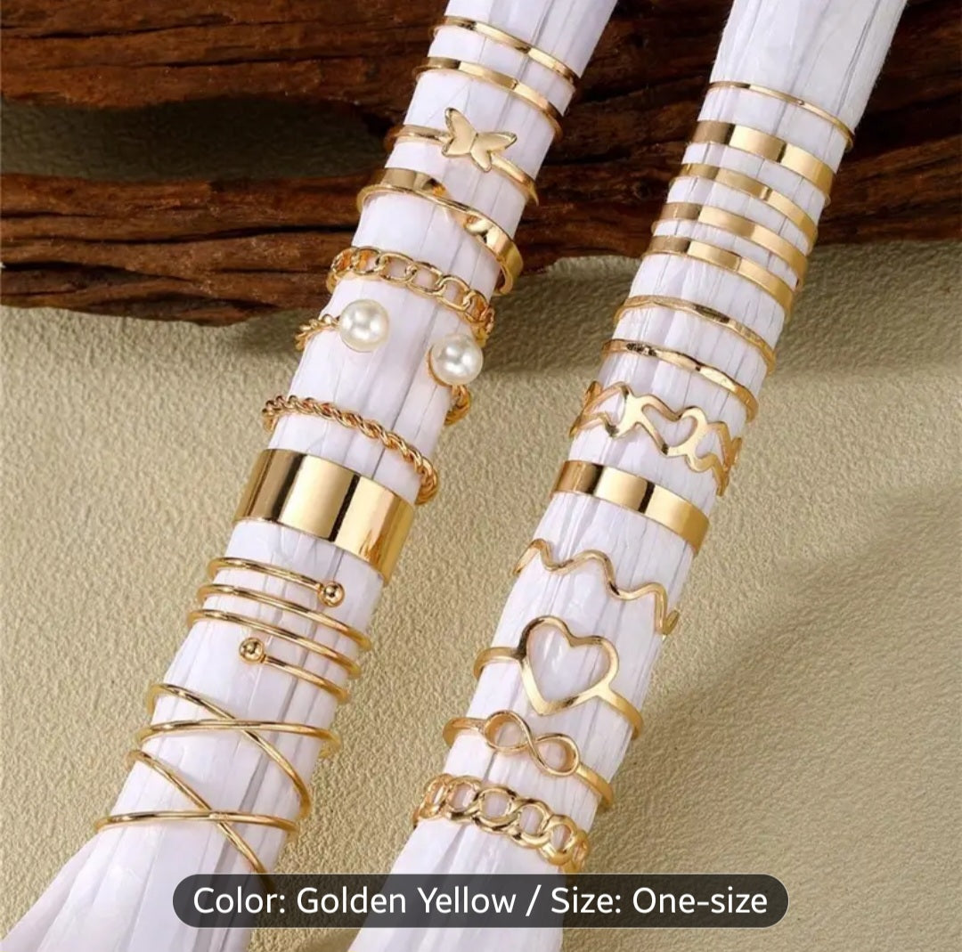 A Set of 22 Womens Rings in Golden Color Featuring Vintage, Fashionable, Minimalist, And Elegant Designs with Hollow Heart And Spiral Shapes. This Golden Ring Set Is Suitable for Daily Wear, Vacations, Parties, And Weddings