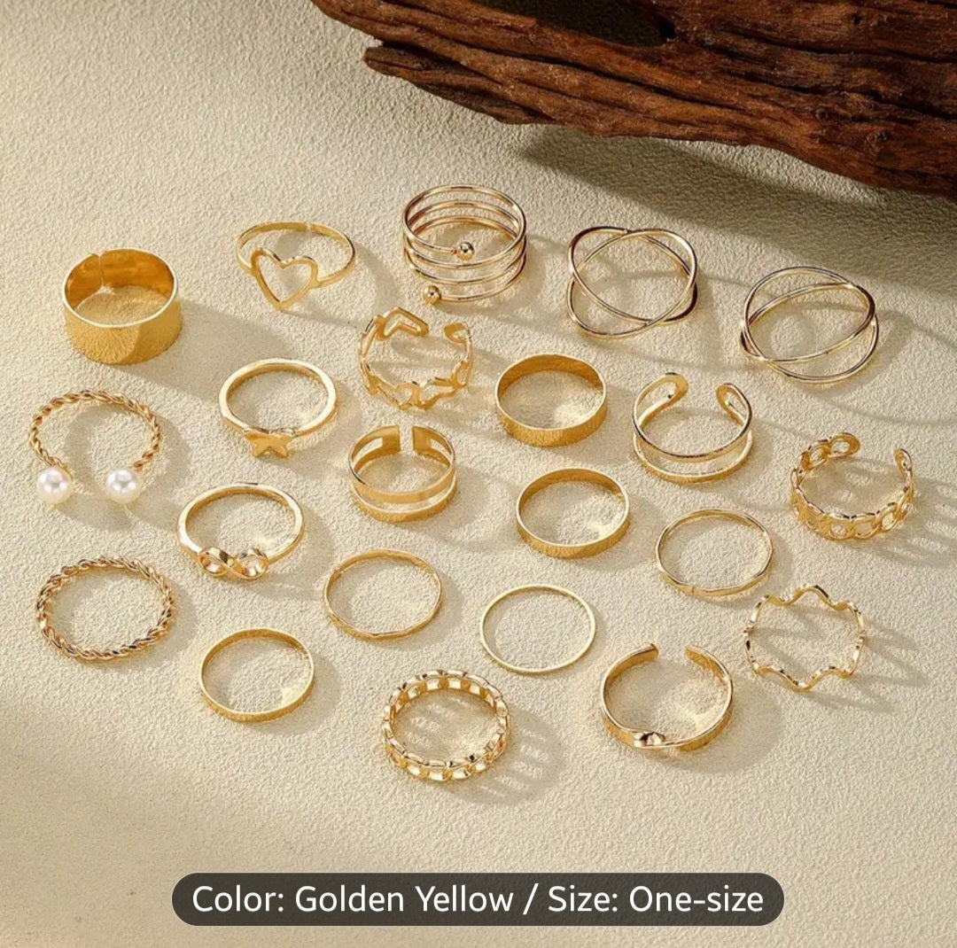 A Set of 22 Womens Rings in Golden Color Featuring Vintage, Fashionable, Minimalist, And Elegant Designs with Hollow Heart And Spiral Shapes. This Golden Ring Set Is Suitable for Daily Wear, Vacations, Parties, And Weddings